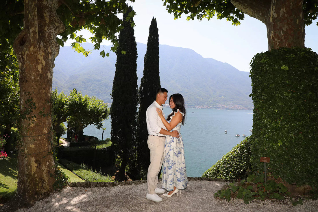 Romantic proposal at Villa del Balbianello in Lake Como with a couple embracing in the gardens, part of a luxury proposal package.