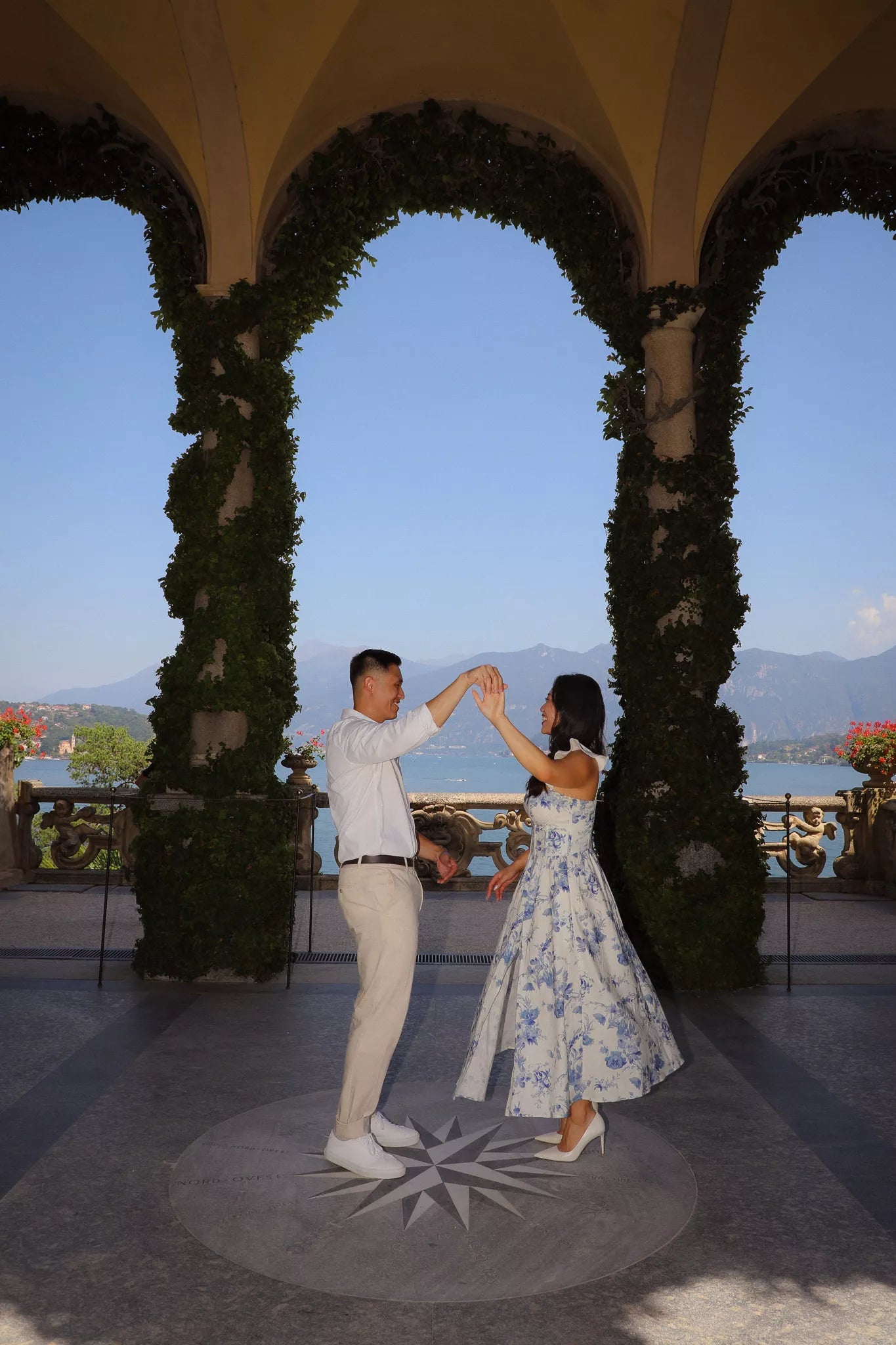 Happy just-engaged moment after a Lake Como surprise proposal with joyful reactions captured in cinematic style