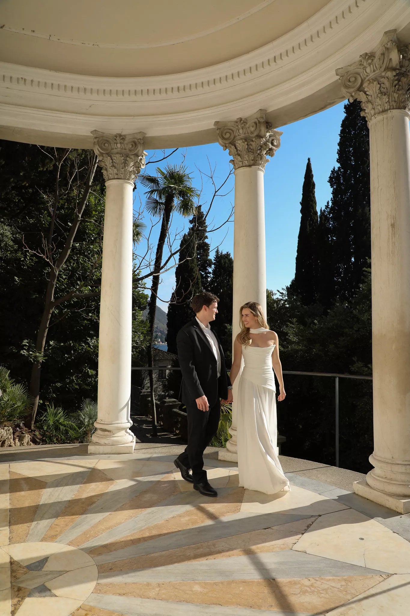 Romantic Lake Como proposal look with bouquet, designer dress, and elegant photography by Nadia Fraqair