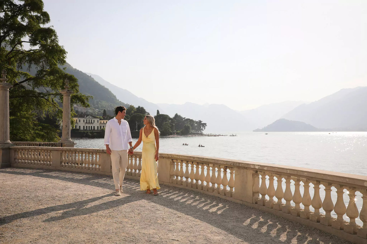 Historic archway by the lake in Villa Melzi Gardens, Bellagio, creating a romantic backdrop for proposals.