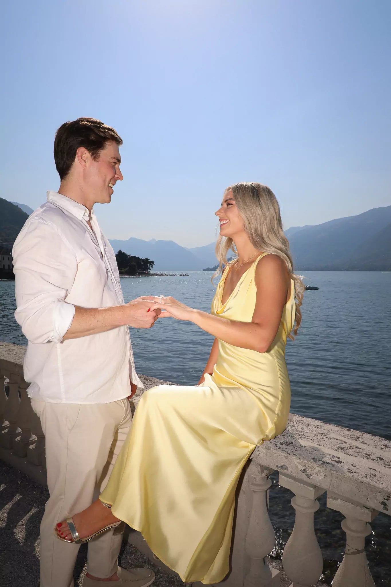 Spring proposal in Villa Melzi Gardens, Bellagio, with cherry blossoms and lake views.