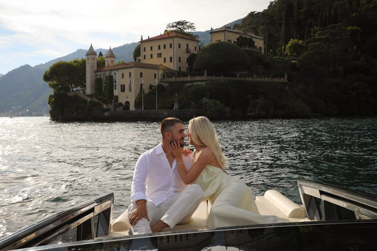 Lake Como private boat proposal at golden hour in front of Villa del Balbianello photographed by Nadia Fraqair
