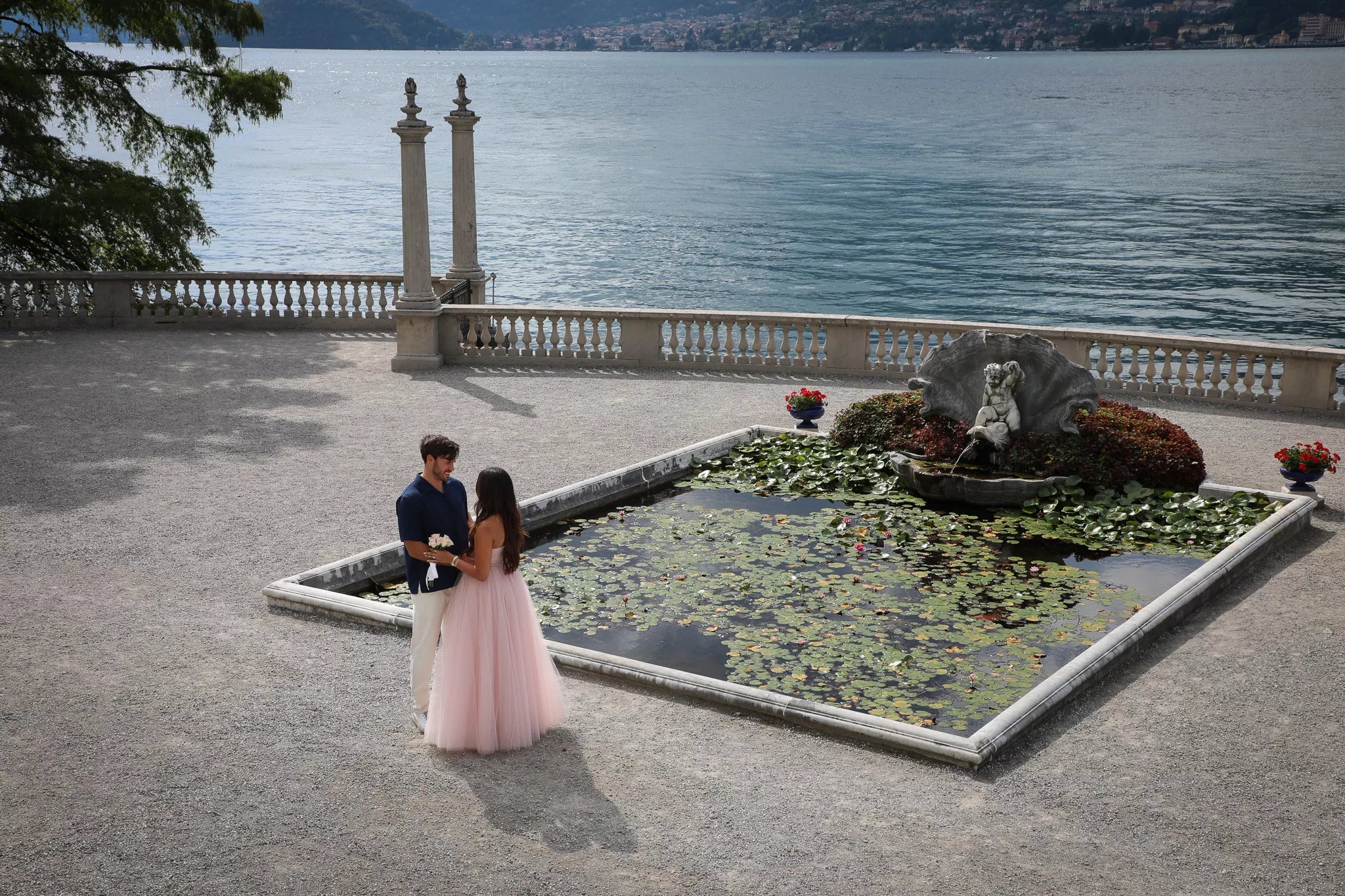 Bellagio proposal photographer Nadia Fraqair capturing a romantic Lake Como engagement at sunset on the lakeside promenade