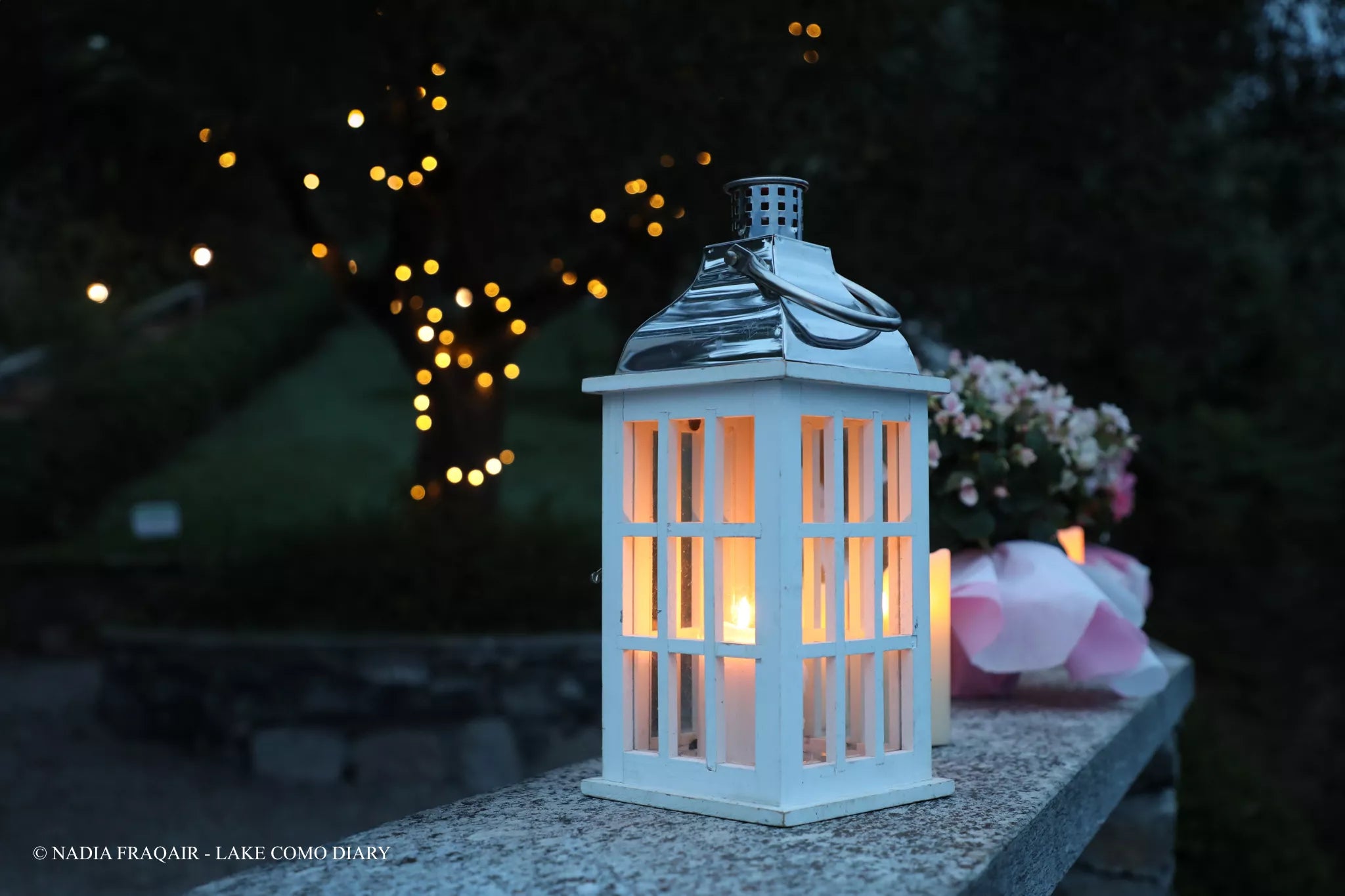 Proposal set-up, soft post-rain light at Castello di Vezio, Lake Como — cinematic detail shot.