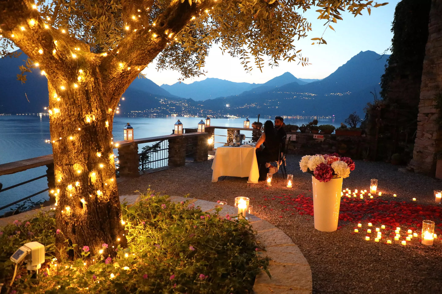 Evening aperitif experience after a Castello di Vezio proposal with candles and Lake Como views