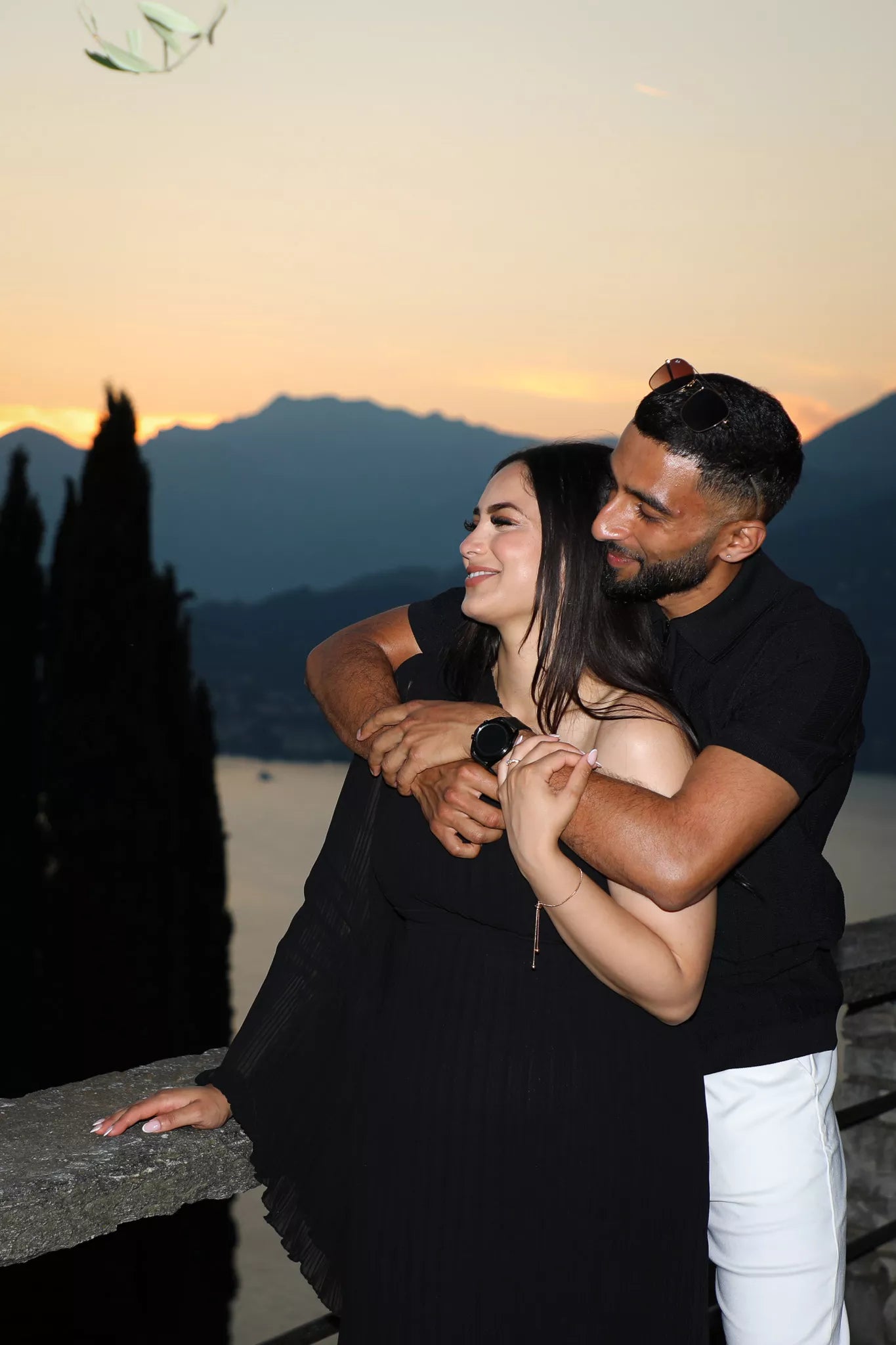 Romantic couple portrait after a Castello di Vezio proposal at sunset overlooking Lake Como