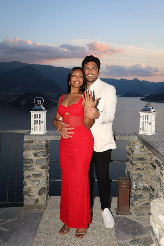 Sunset proposal scene at Castello di Vezio terrace.