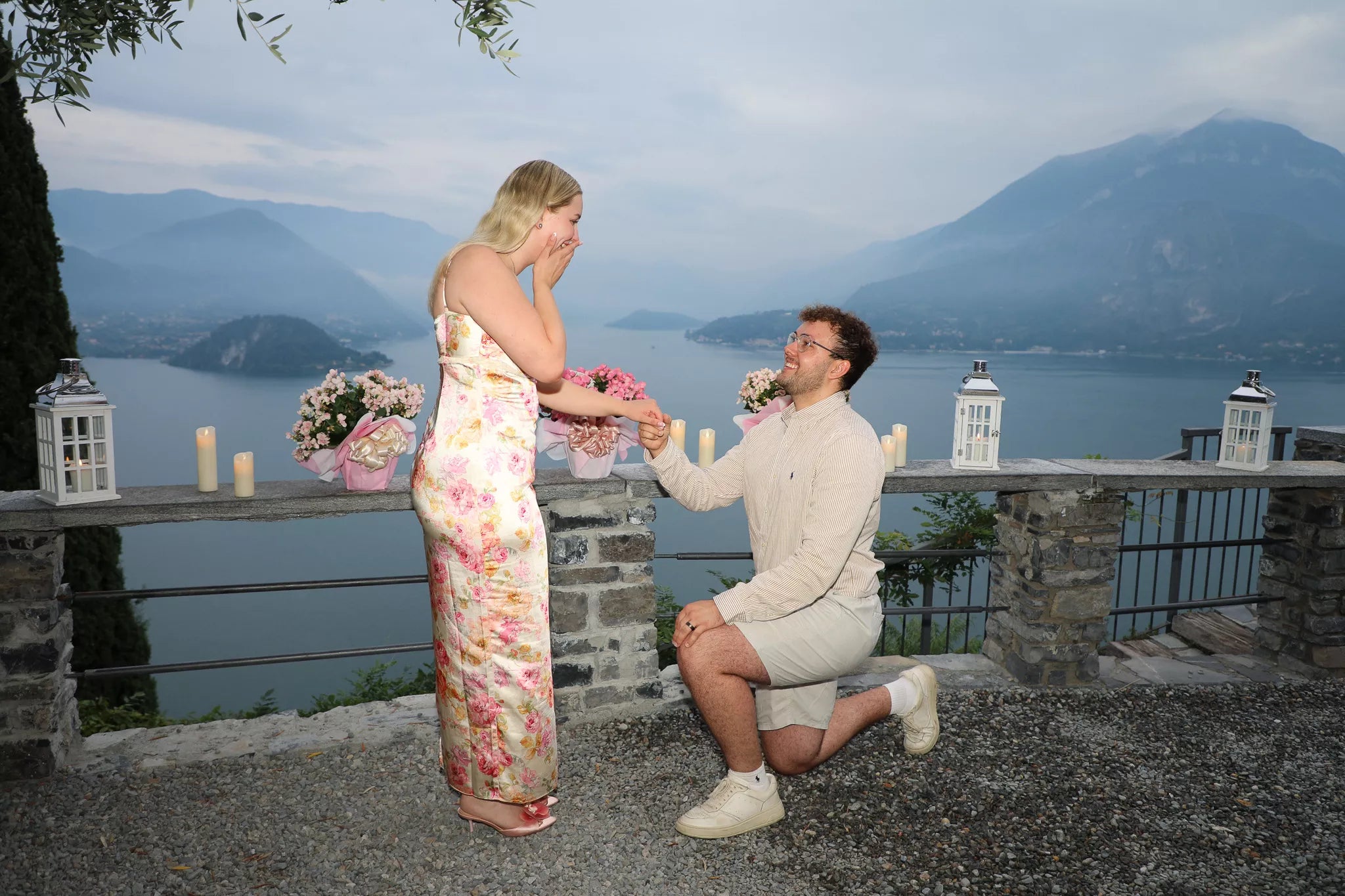 Romantic proposal portraits at Castello di Vezio castle walls in Varenna Lake Como