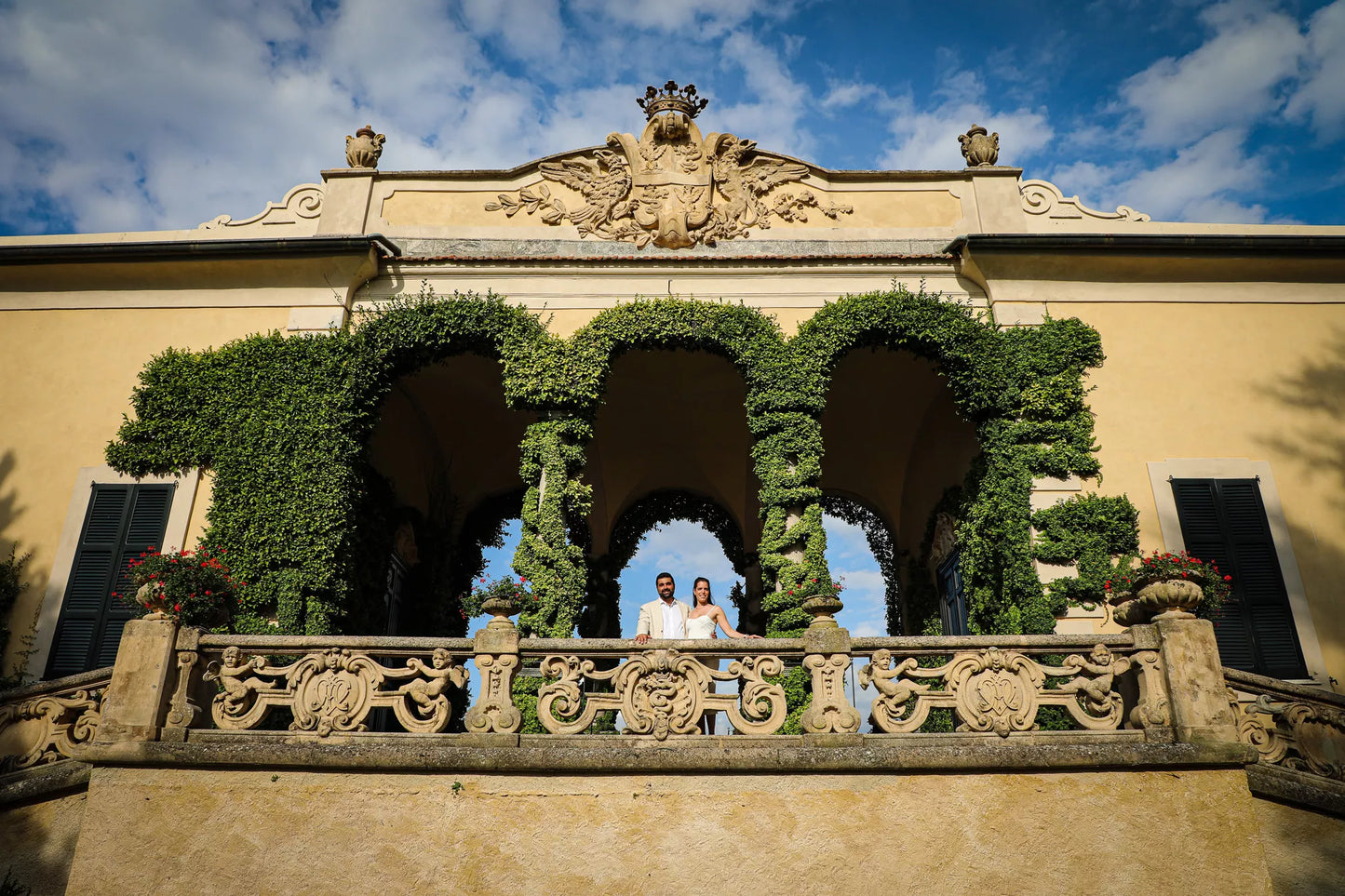 Designer dress proposal package in Lake Como villa gardens with luxury styling and proposal photography
