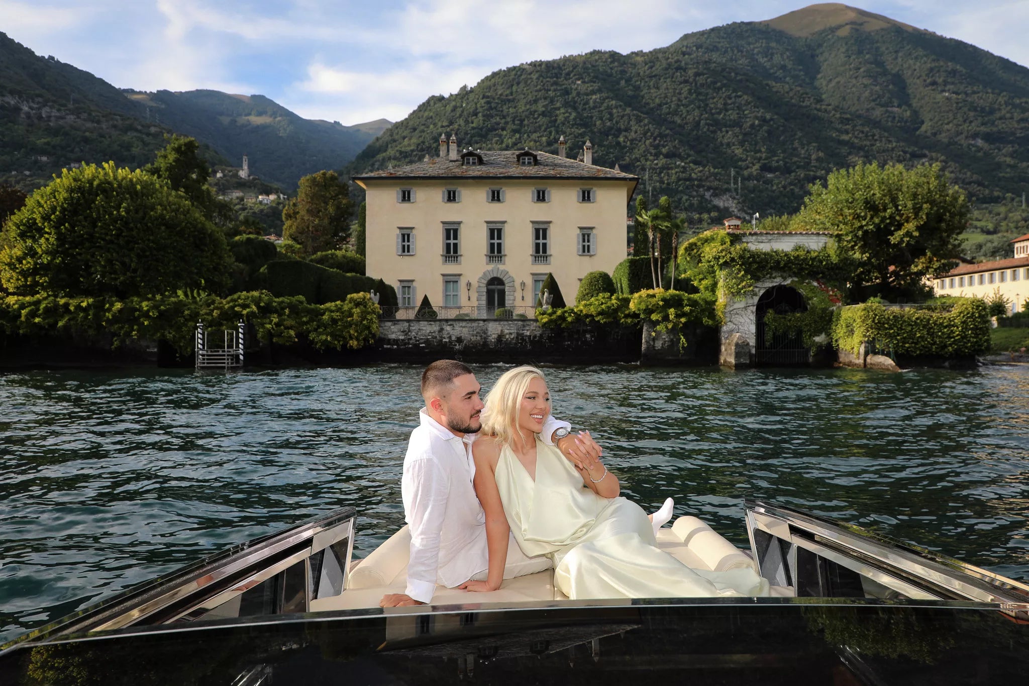 Candid Lake Como engagement photography capturing a joyful couple laughing together