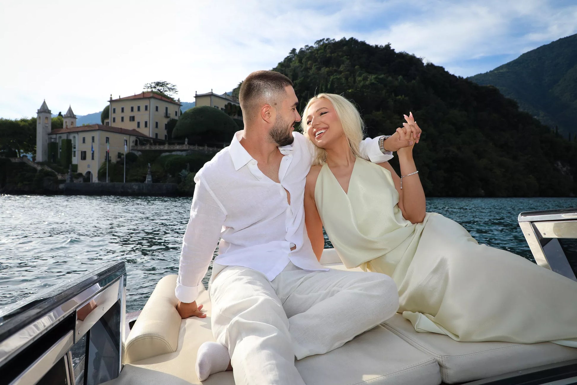 Lake Como engagement photography at golden hour with a couple by the lakeside