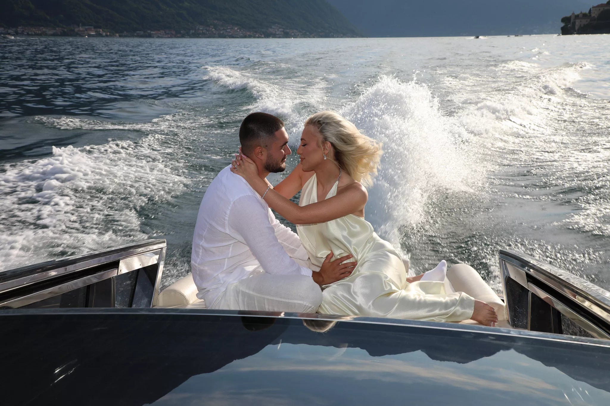 Private boat proposal on Lake Como at sunset captured by photographer Nadia Fraqair