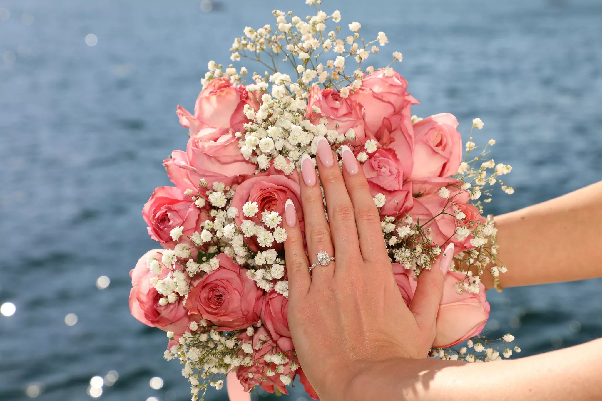 Fresh bouquet and designer dress detail for a Lake Como proposal photography package