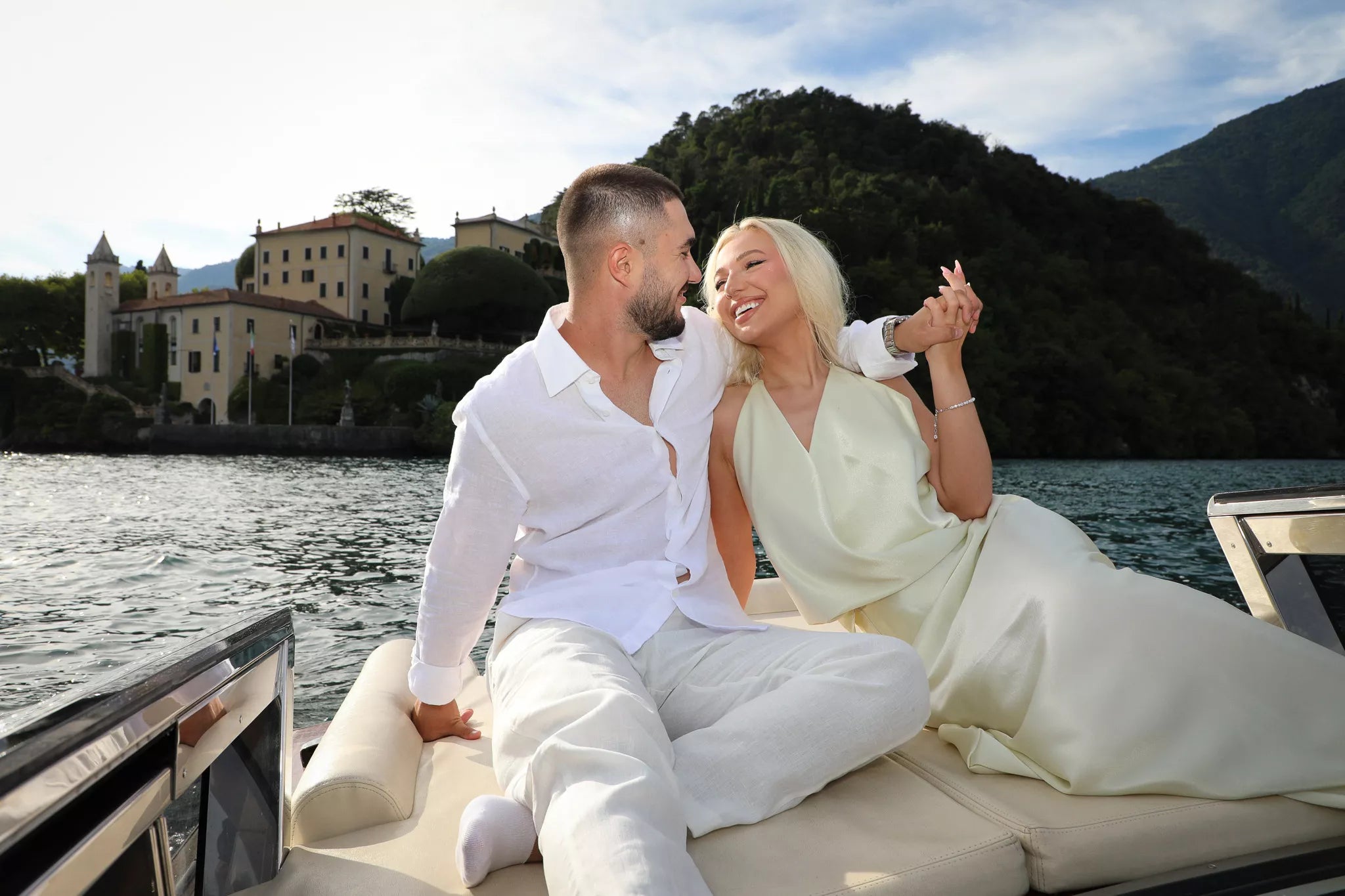 Private boat proposal photography on Lake Como aboard a classic wooden boat