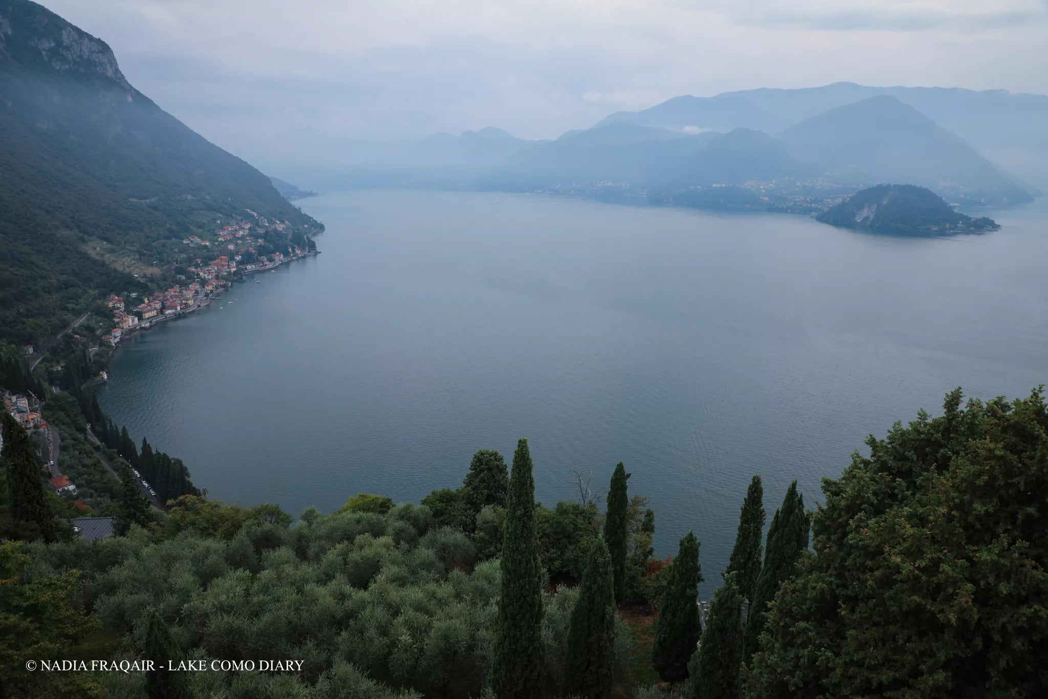Rainy-day atmosphere at Castello di Vezio terrace overlooking Varenna, Lake Como — cinematic proposal location.