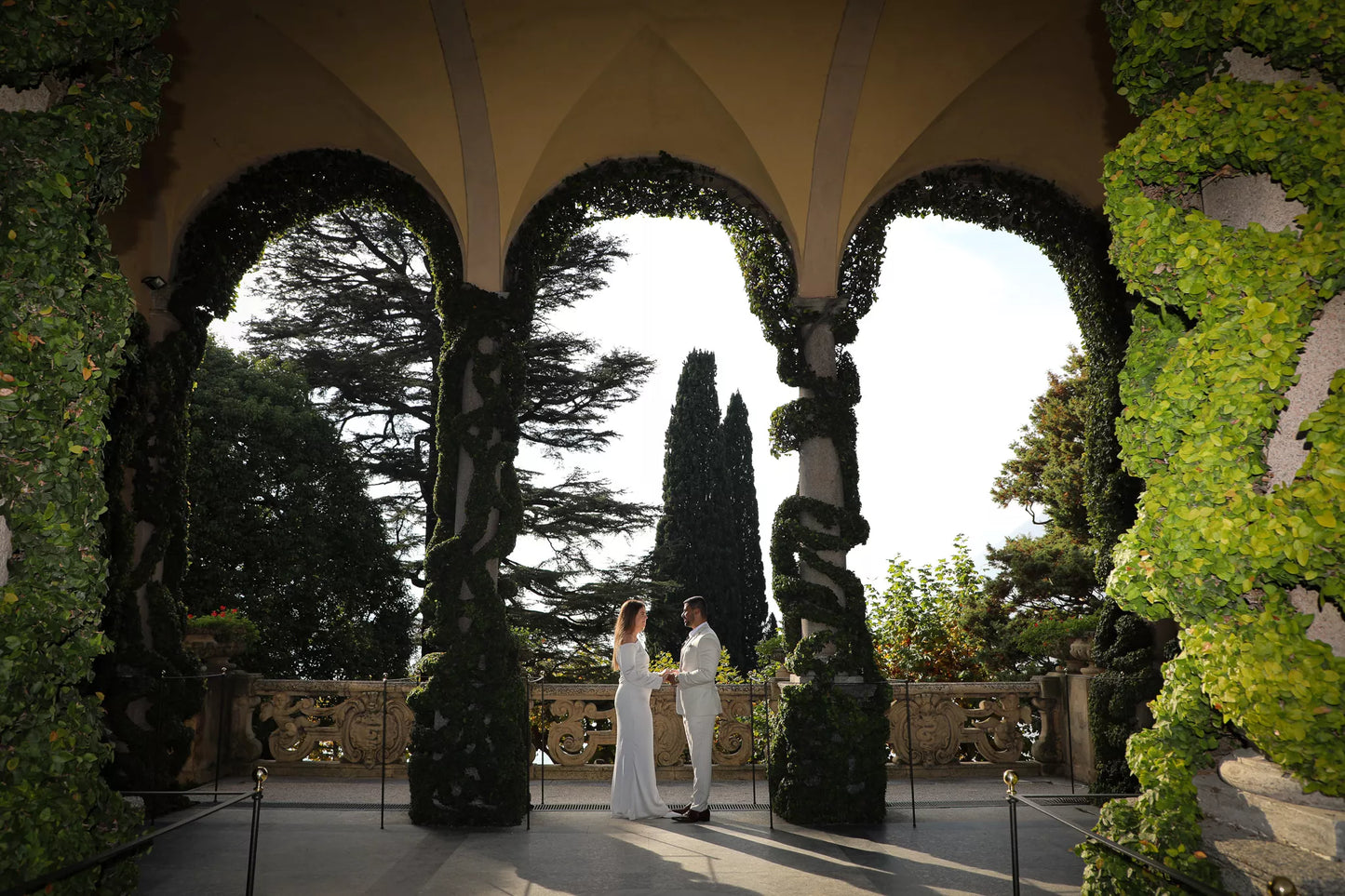 Villa del Balbianello proposal couple under the iconic loggia with Lake Como views