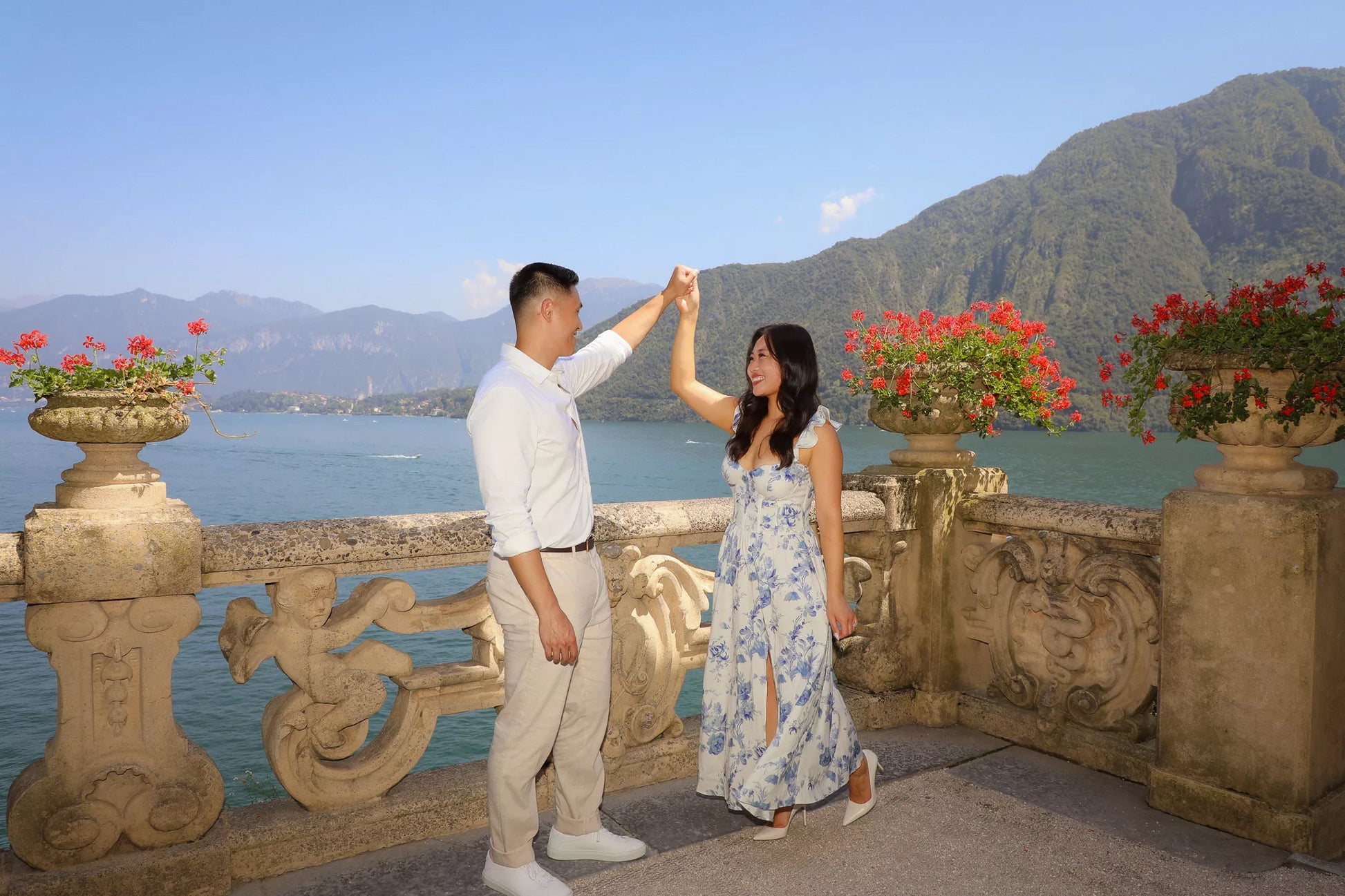 Villa del Balbianello proposal couple celebrating on the terrace with Lake Como views