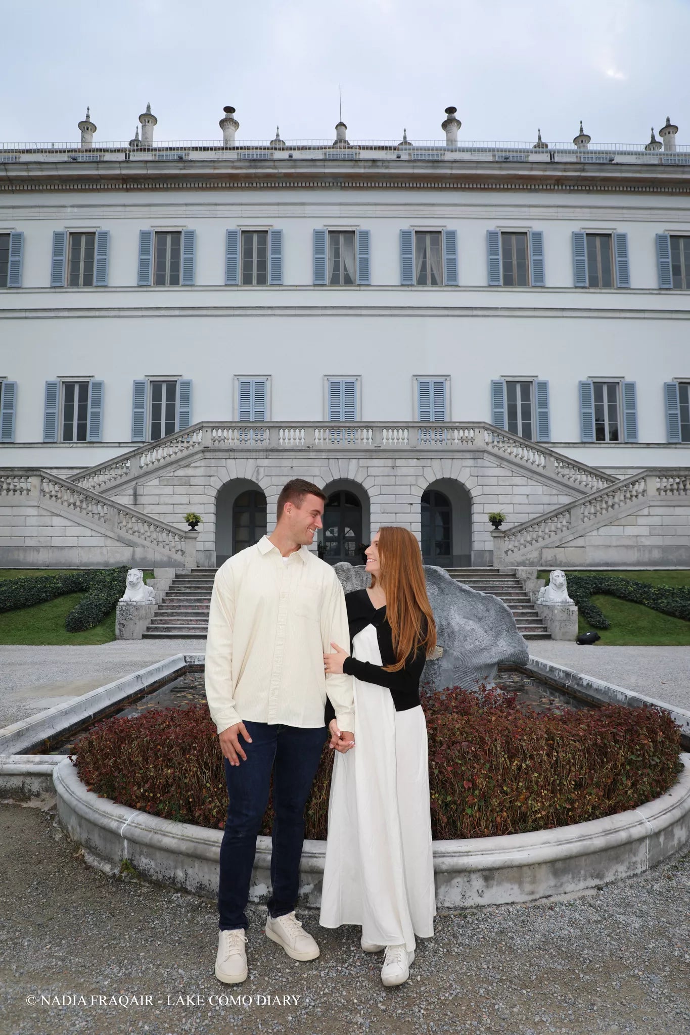Engaged couple walking through Villa Melzi Gardens in Bellagio after a Lake Como proposal